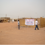 Signboard of World Water Day in the main market street in Bentiu